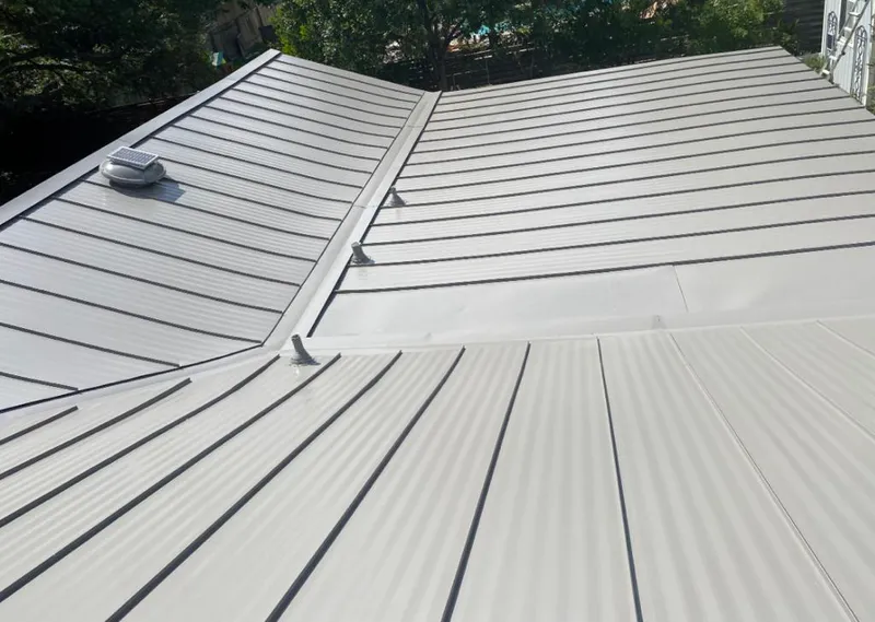 Solar attic fan installed on a metal roof for Roof Ventilation in Bismarck